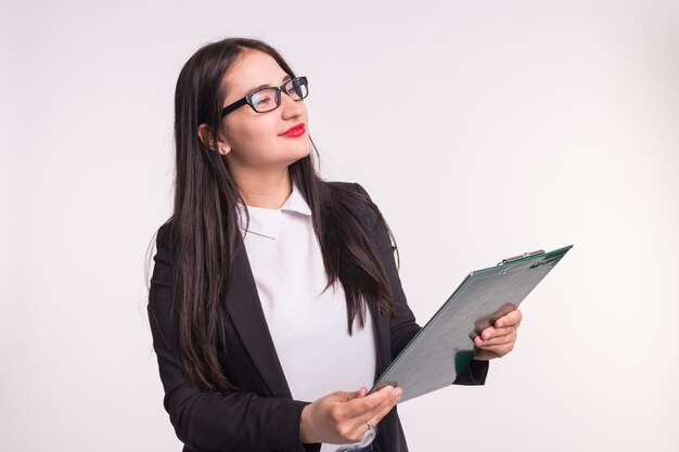 Business, work and people concept - Asian young woman holding a folder.