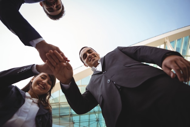 Businesses executives forming a hand stack