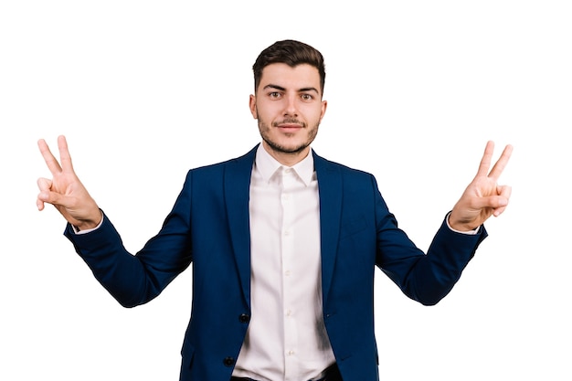 Businessman acting victory sign isolated