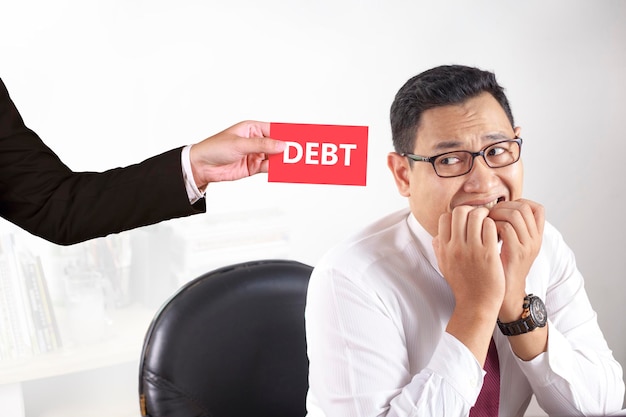 Фото businessman afraid of debt concept