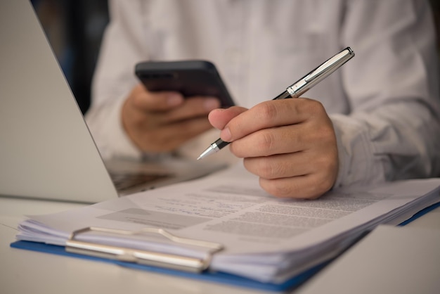 Photo businessman agree to make deal signing document sale contract or legal transaction contract at desk