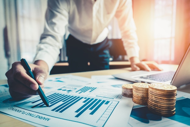 Businessman analyze data of stock market research.