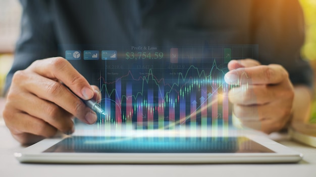 Businessman analyzing company financial report with augmented reality graphic