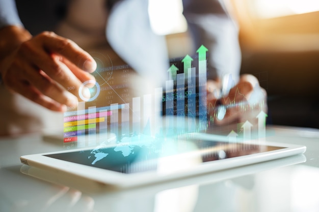 businessman analyzing company financial report with augmented reality graphic