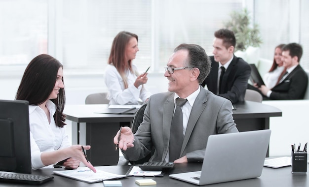 Businessman analyzing investment budget and income charts at his workplace