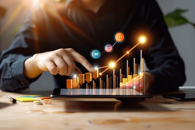 Businessman analyzing sales data with tablet and economic growth graph