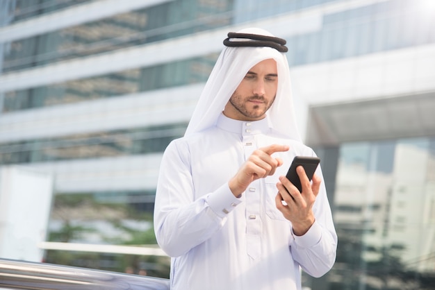 businessman arabic hand using mobile phone. 