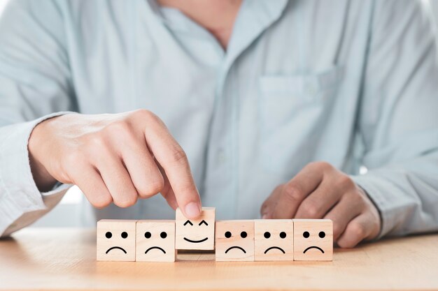 Businessman arranging wooden cubes