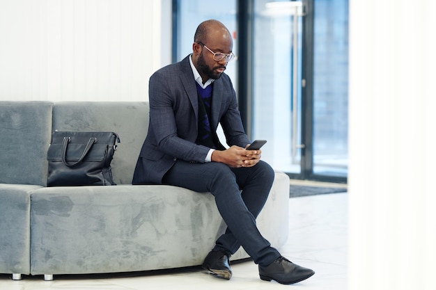 Businessman awaiting the meeting in the lobby