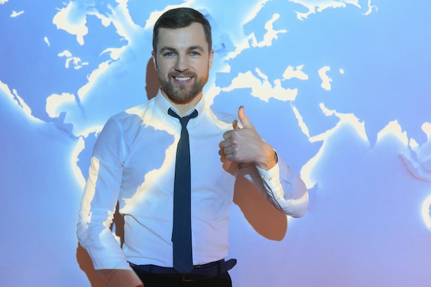 Businessman on the background of the world map international economy