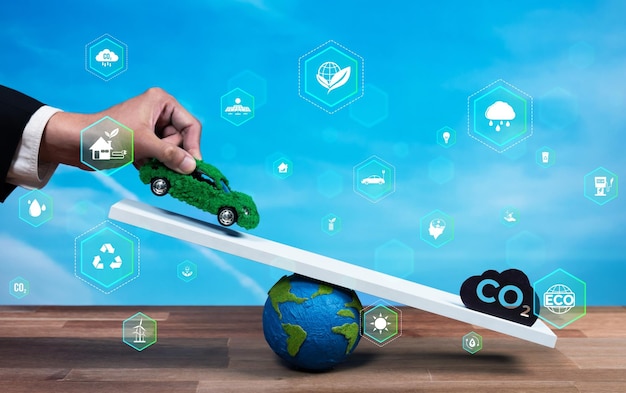 사진 비즈니스맨  ⁇ 런스 그린 ev 자동차 모델 스케일과 이산화탄소 배출 아이콘은 네트 제로 지속 가능한 에너지를 사용하여 친환경 자동차를 통해 탄소를 줄이기위한 esg 약속의 개념을 보여줍니다.