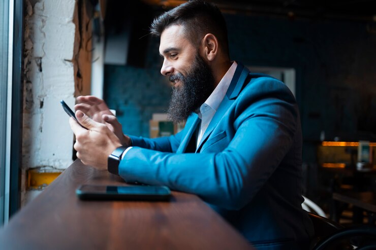 Businessman in a bar buying from the internet