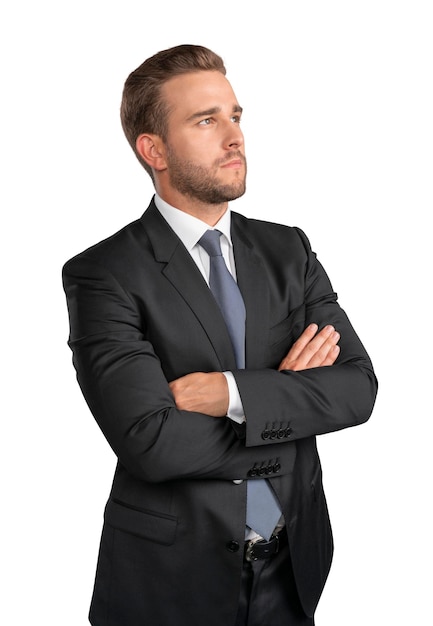 Businessman in black suit arms crossed isolated over white background