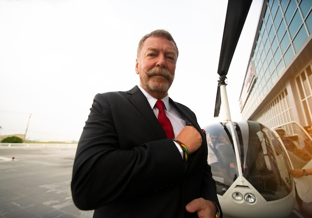 Businessman in black suit outdoors