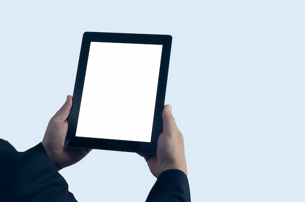 Photo businessman in blue jacket is holding a tablet with a white screen