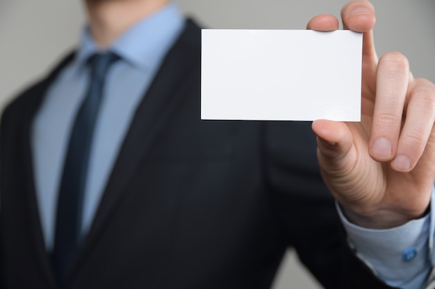 Businessman ,Business Mans hand hold showing business card  close up shot