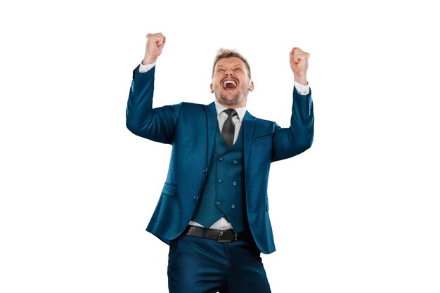 Businessman in a business suit is excited about success