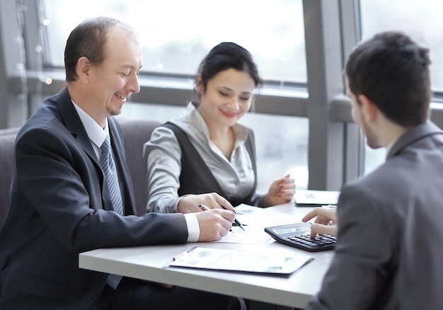 Businessman and business team analyzing financial data