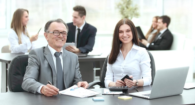 Businessman and business team at the workplace