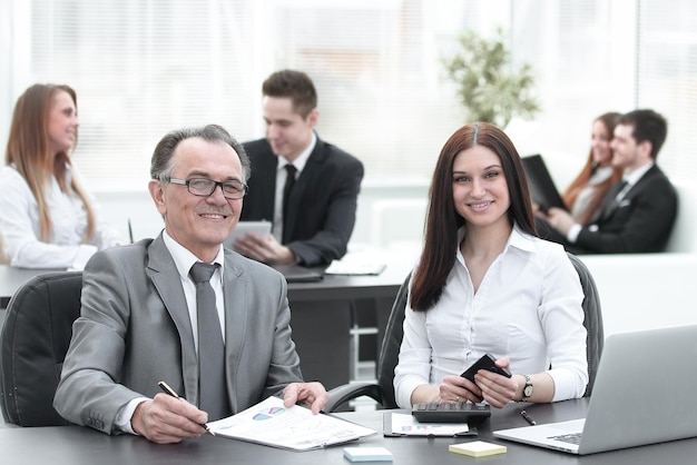 Businessman and business team at the workplace