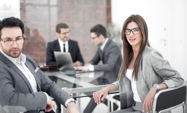 Businessman and business woman sitting at the Deskbusiness concept