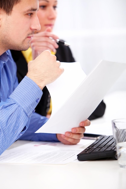 Businessman and businesswoman are working at office