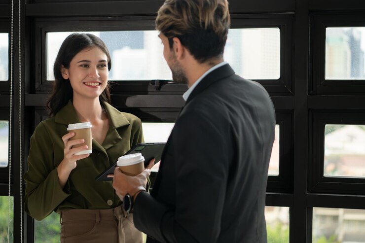 Businessman and businesswoman talking in coffee shop Business people concept