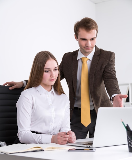 Businessman and businesswoman at work