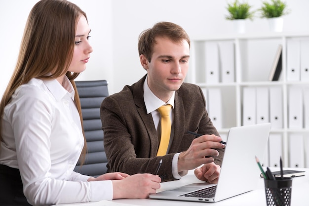 Businessman and businesswoman at work