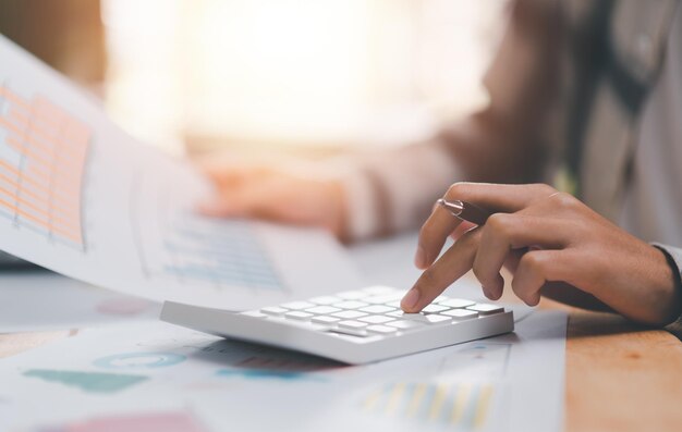 Businessman calculating figures in company financial documents with a ct