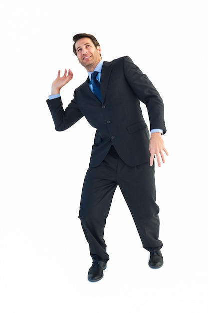 Businessman carrying something heavy with his hands