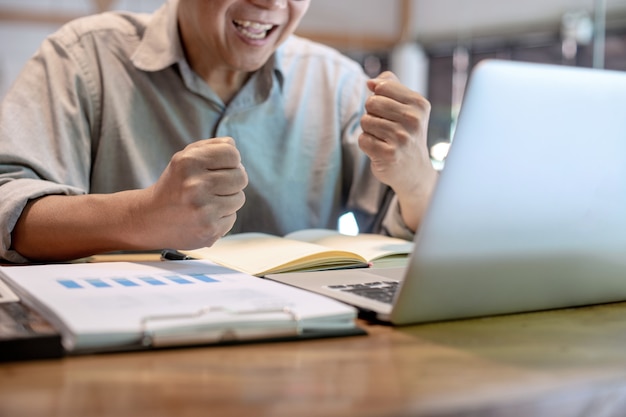 Businessman in casual style working with graph