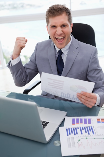 Businessman celebrating market research results