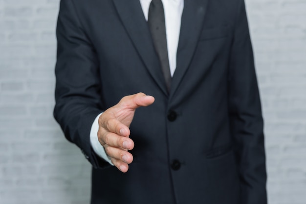 Photo businessman check hand on gray background