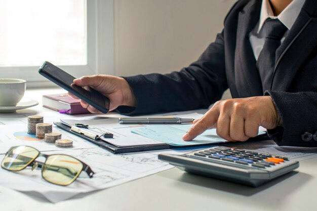 Photo businessman checking accounts and business income, the concept of financial management and financing.