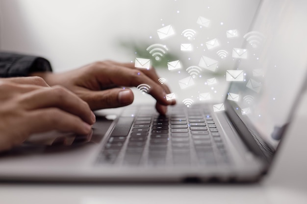 Businessman checking emails on laptop computer