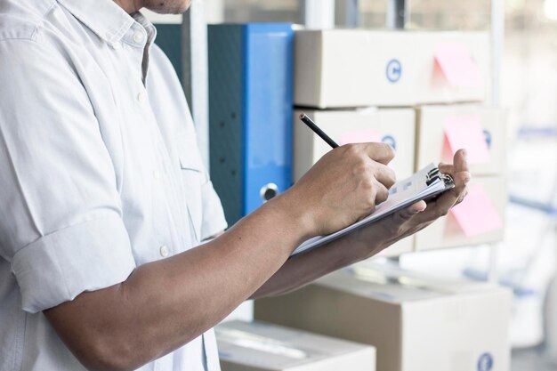 businessman checking list of goods