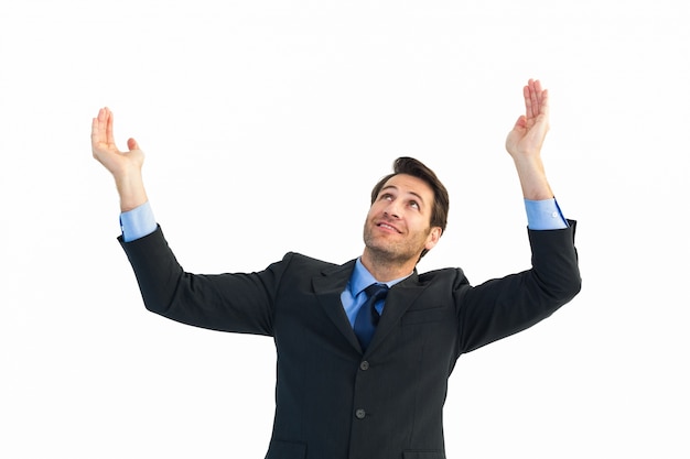 Businessman cheering with hands raised