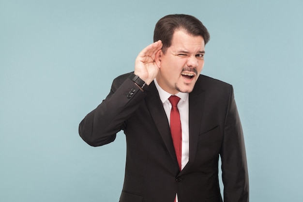 Businessman in classic wear listening another man