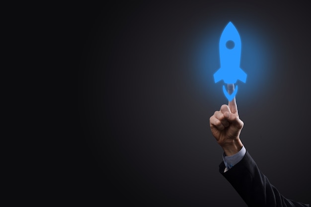 Photo businessman clicking on rocket icon