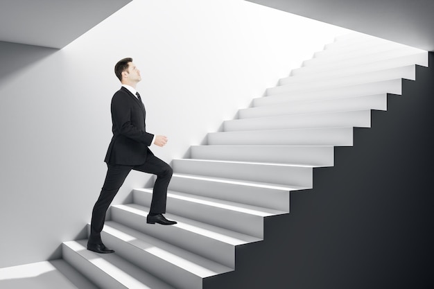 Businessman climbing stairs