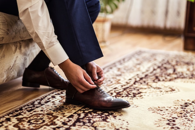 Businessman clothes shoes, man getting ready for work,groom morning before wedding ceremony