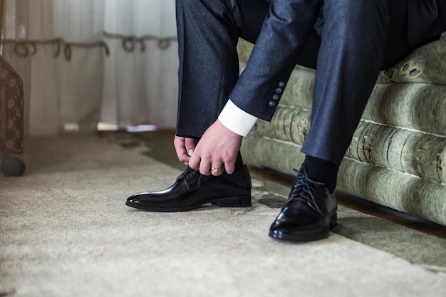 Businessman clothes shoes man getting ready for workgroom morning before wedding ceremony