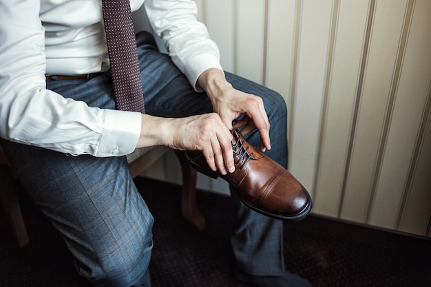 Businessman clothes shoes man getting ready for workgroom morning before wedding ceremony