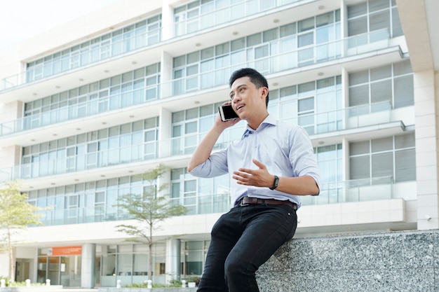 Businessman consulting client on phone