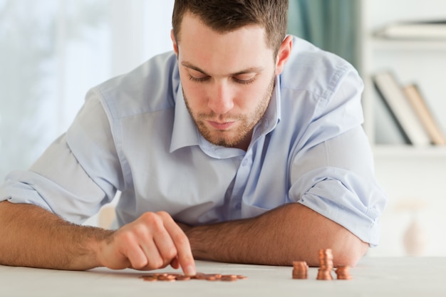 Businessman counting his small change