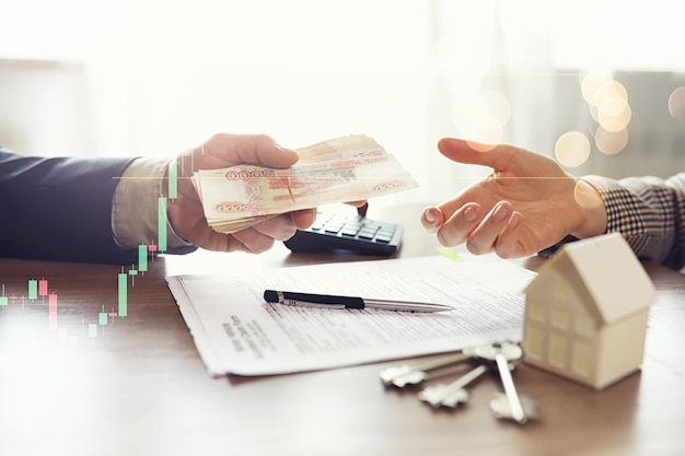 Businessman counting money Russian ruble currency while making an agreement contact with his partner in the office loan and financial concept