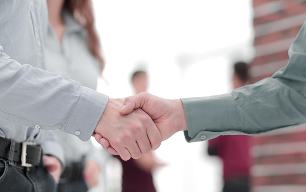 Businessman and a coworker shaking hands during a meeting