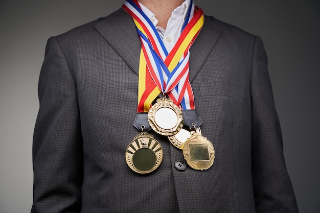 Businessman decorated with numerous medals standing