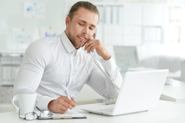 Businessman at the desk working in the office